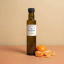 Tangerine Aged White Balsamic Vinegar 250ml bottle on warm terracotta surface