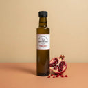 Pomegranate White Balsamic Vinegar 250ml bottle on warm terracotta surface