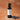 Blueberry White Balsamic Vinegar bottle with fresh blueberries on terracotta surface