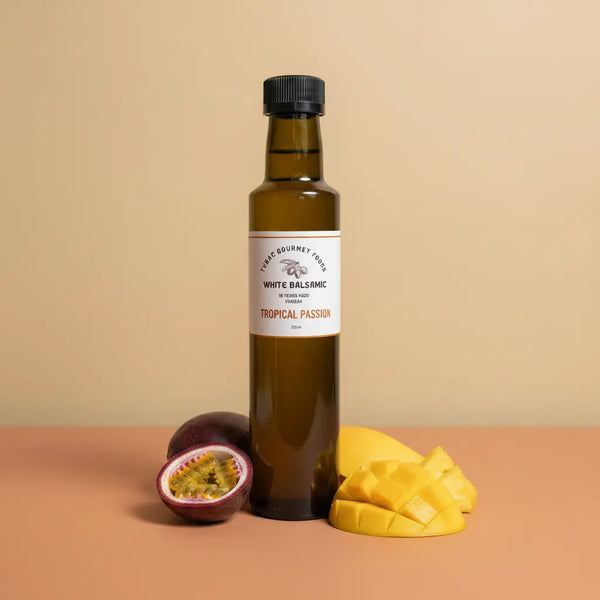 Tropical Passion White Balsamic Vinegar 250ml bottle on warm terracotta surface