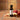 Apple Cinnamon White Balsamic Vinegar bottle with apple slices and cinnamon sticks on terracotta surface