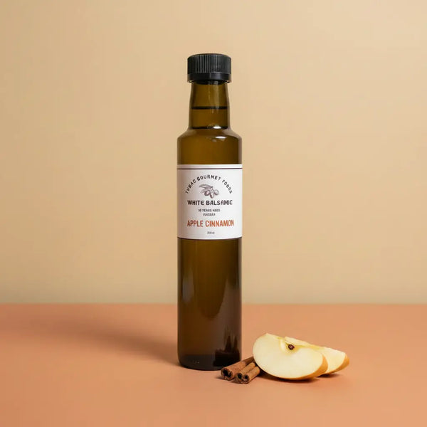 Apple Cinnamon White Balsamic Vinegar 250ml bottle on warm terracotta surface
