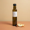 Apple Cinnamon White Balsamic Vinegar 250ml bottle on warm terracotta surface