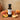 Peach White Balsamic Vinegar bottle with fresh peaches on terracotta surface