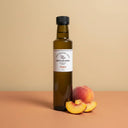 Peach White Balsamic Vinegar 250ml bottle on warm terracotta surface