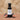 Fig White Balsamic Vinegar bottle with fresh figs on terracotta surface