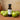 Green Apple White Balsamic Vinegar bottle with fresh green apples on terracotta surface