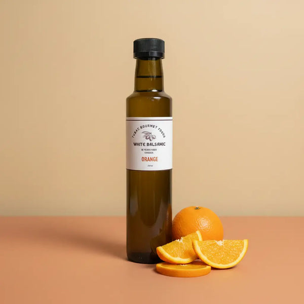 Orange White Balsamic Vinegar 250ml bottle on warm terracotta surface