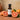 Grapefruit White Balsamic Vinegar bottle with fresh grapefruit on terracotta surface