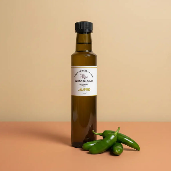 Jalapeno Aged White Balsamic Vinegar 250ml bottle on warm terracotta surface