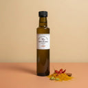 Curry White Balsamic Vinegar 250ml bottle on warm terracotta surface