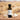 Garlic White Balsamic Vinegar bottle with garlic bulbs on terracotta surface
