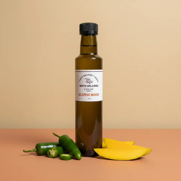 Jalapeno Mango Aged White Balsamic Vinegar 250ml bottle on warm terracotta surface