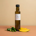 Jalapeno Mango Aged White Balsamic Vinegar 250ml bottle on warm terracotta surface
