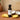Pina Colada White Balsamic Vinegar bottle with pineapple and coconut on terracotta surface