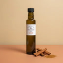 Cinnamon White Balsamic Vinegar 250ml bottle on warm terracotta surface
