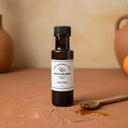 Traditional Aged White Balsamic Vinegar bottle on terracotta surface
