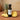 Pineapple Aged White Balsamic Vinegar bottle with fresh pineapple on terracotta surface