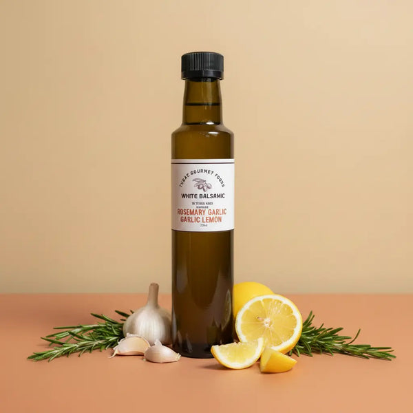 Rosemary Garlic Lemon White Balsamic Vinegar 250ml bottle on warm terracotta surface