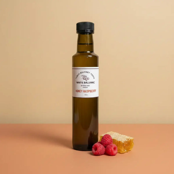 Honey Raspberry Dark Balsamic Vinegar 250ml bottle on warm terracotta surface