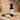 Cucumber Melon White Balsamic Vinegar bottle with cucumber and melon on terracotta surface