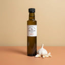 Garlic White Balsamic Vinegar 250ml bottle on warm terracotta surface