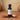 Tiramisu White Balsamic Vinegar bottle with espresso beans and cocoa on terracotta surface