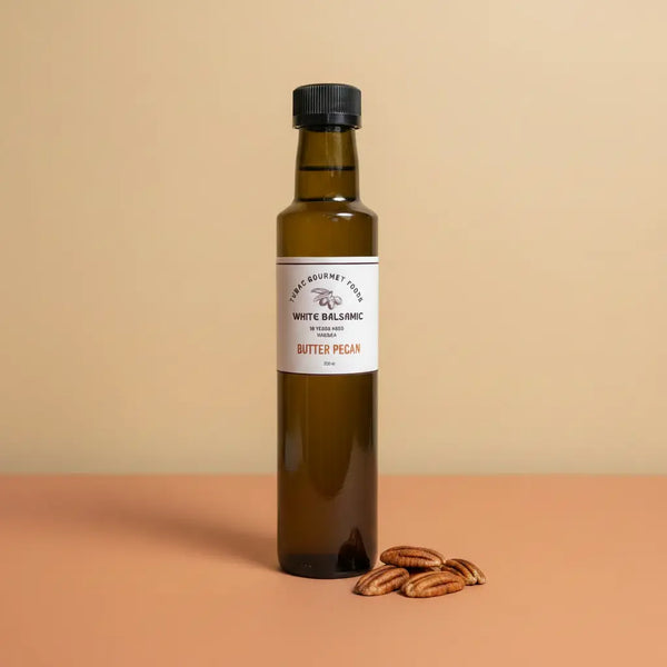 Butter Pecan White Balsamic Vinegar 250ml bottle on warm terracotta surface