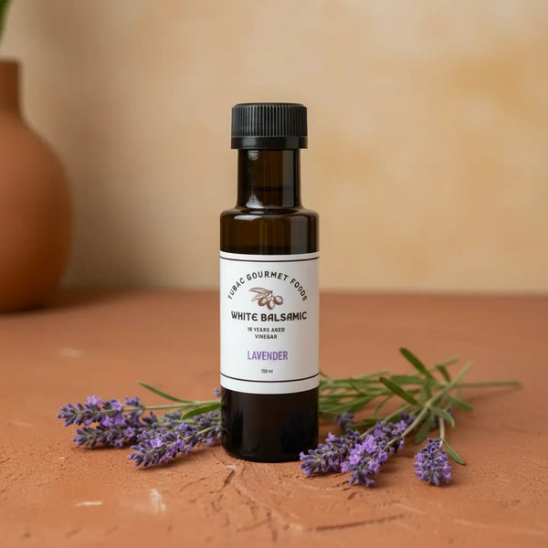 Lavender White Balsamic Vinegar bottle with fresh lavender sprigs on terracotta surface