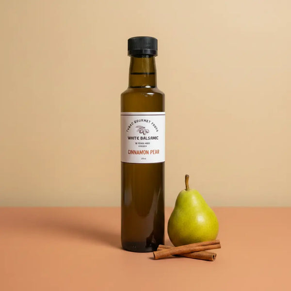 Cinnamon Pear White Balsamic Vinegar 250ml bottle on warm terracotta surface