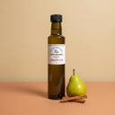Cinnamon Pear White Balsamic Vinegar 250ml bottle on warm terracotta surface