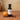Pumpkin Pie White Balsamic Vinegar bottle with pumpkin and cinnamon sticks on terracotta surface