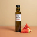 Watermelon White Balsamic Vinegar 250ml bottle on warm terracotta surface