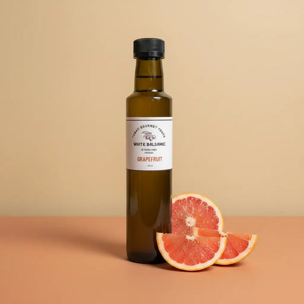 Grapefruit Aged White Balsamic Vinegar 250ml bottle on warm terracotta surface